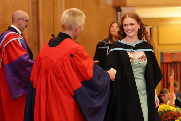 Graduates receiving their award